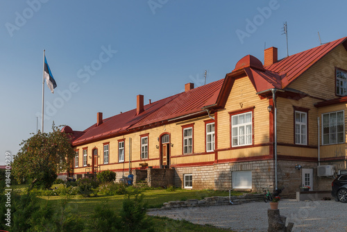 KADRINA, ESTONIA - AUGUST, 15, 2024: Historic wooden building with traditional architecture photographed in sunlight.