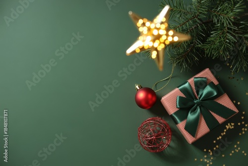 Festive Christmas Arrangement: A beautifully arranged holiday scene, featuring a wrapped gift, sparkling star decoration, and evergreen sprigs against a vibrant backdrop.