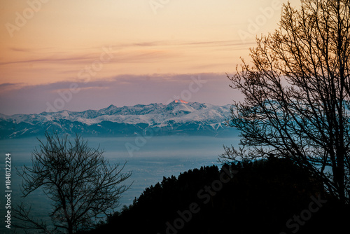 sunset over the snow-capped mountains