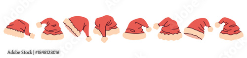 Horizontal set of various red winter caps arranged in a line. Festive border element featuring traditional Santa headwear for holiday designs.