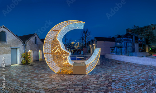 Paris - France,France - 12 16 2025: Paris By Christmas Night. View Saint-Emilion courtyard at Bercy Village decorating for christmas at blue hour