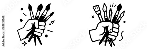 Creative hand holding multiple paintbrushes for artistic expression