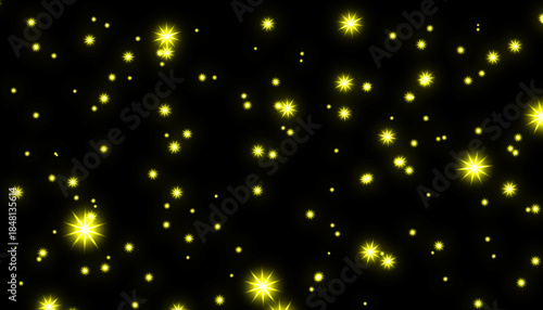 Glimmering yellow stars on black background