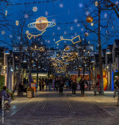 Paris - France,France - 12 16 2025: Paris By Christmas Night. View Saint-Emilion courtyard at Bercy Village decorating for christmas at blue hour
