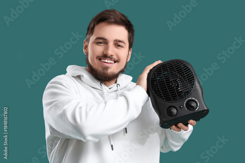 Young man with black electr...