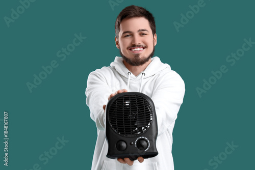 Young man with black electr...