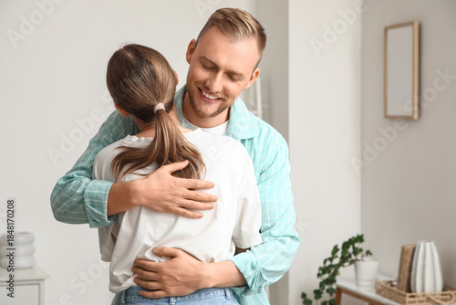 Happy young couple hugging ...
