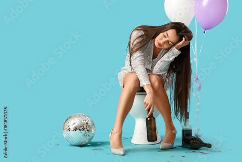 Drunk young woman sitting o...
