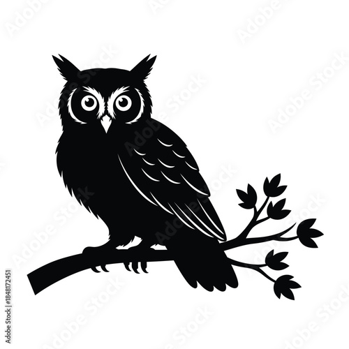 Owl silhouette perched on a branch with leaves