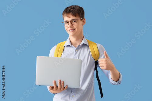 Male student with laptop sh...