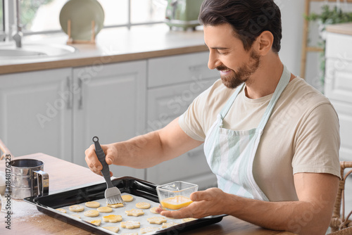 Young man preparing cookies...
