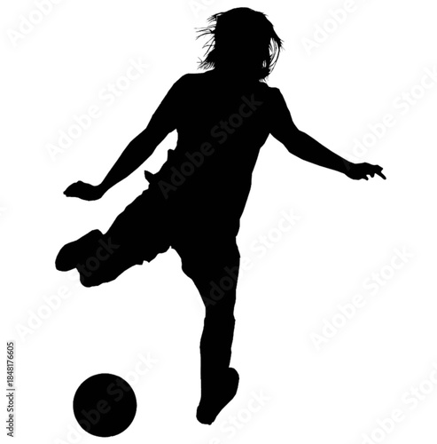 Female athlete kicking a soccer ball during a match.