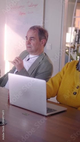 Vertical. Diverse Team of Professional Business people Meeting in the Office Conference Room. Creative Team Around Table, colleagues Speak for Marketing Campaign Social Media Strategy Modern Workplace
