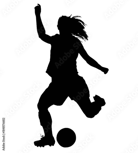 Female soccer player kicking a ball during a game.