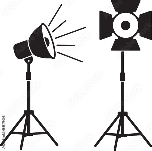 Two black silhouette studio lighting stands with adjustable heads and radiating light beams on a white background, and production concepts also transparent background