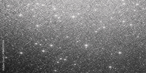 A closeup of water rain drops on the window creates a textured pattern against a dark grey rough stone wall and black asphalt street surface background