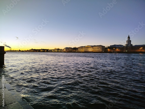 Sunset view over water in a city by the river