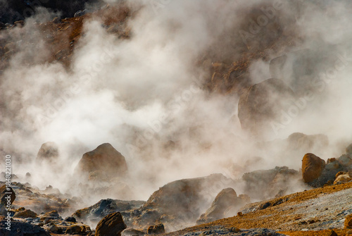 Krýsuvík is a vibrant geothermal area on Iceland's Reykjanes Peninsula, famous for its colorful, mineral-stained hills, bubbling mud pots, steaming fumaroles (steam vents), and hot springs.