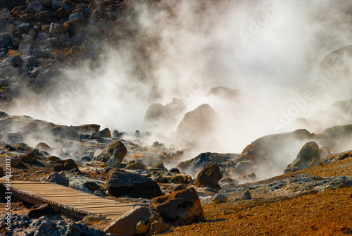 Krýsuvík is a vibrant geothermal area on Iceland's Reykjanes Peninsula, famous for its colorful, mineral-stained hills, bubbling mud pots, steaming fumaroles (steam vents), and hot springs.