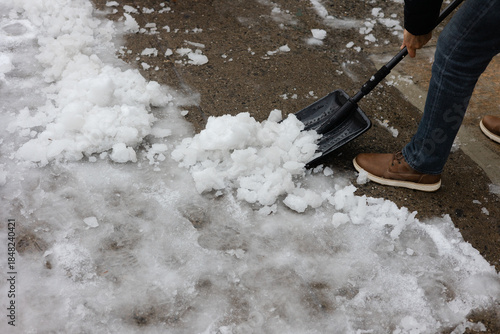 Wallpaper Mural Snow is removed from the ground using a shovel on a winter day in a residential area Torontodigital.ca