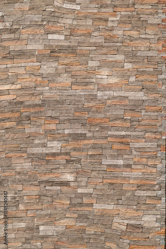 Natural stone wall texture with stacked rectangular slabs