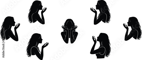 Collection of elegant black silhouettes of a beautiful woman profile with long hair and blowing a kiss isolated on white background for beauty.