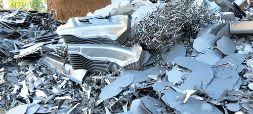 Tableau sur toile ​A heap of recycled metal fragments, perforated sheets, and industrial remnants in a scrapyard