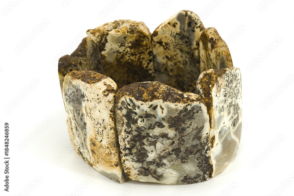 Obraz premium Artistic Baltic amber bracelet made of chalk amber stones on white background