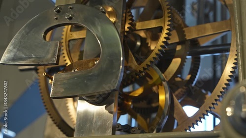 Close up of rotating clock gears and moving mechanical parts without clock face. Time mechanism, engineering precision, teamwork and process concept. Business, technology themes