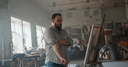 Frustrated artist experiencing creative block in studio