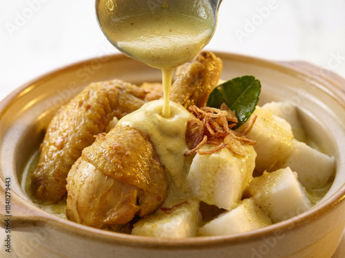 Ultra Realistic Ketupat and Opor Ayam with Creamy Coconut Sauce Pouring