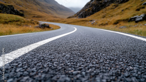 Wallpaper Mural A picturesque winding road cuts through stunning mountain scenery, showcasing the natural beauty and serenity of a tranquil landscape perfect for road trips. Torontodigital.ca