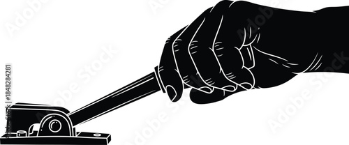 A hand holding a small tool resembling a stapler or a similar device