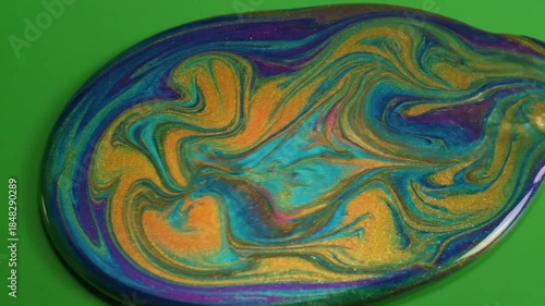 Oil slick iridescent ripple effect on calm water with oil slick effect with iridescent effect green screen liquid effects style