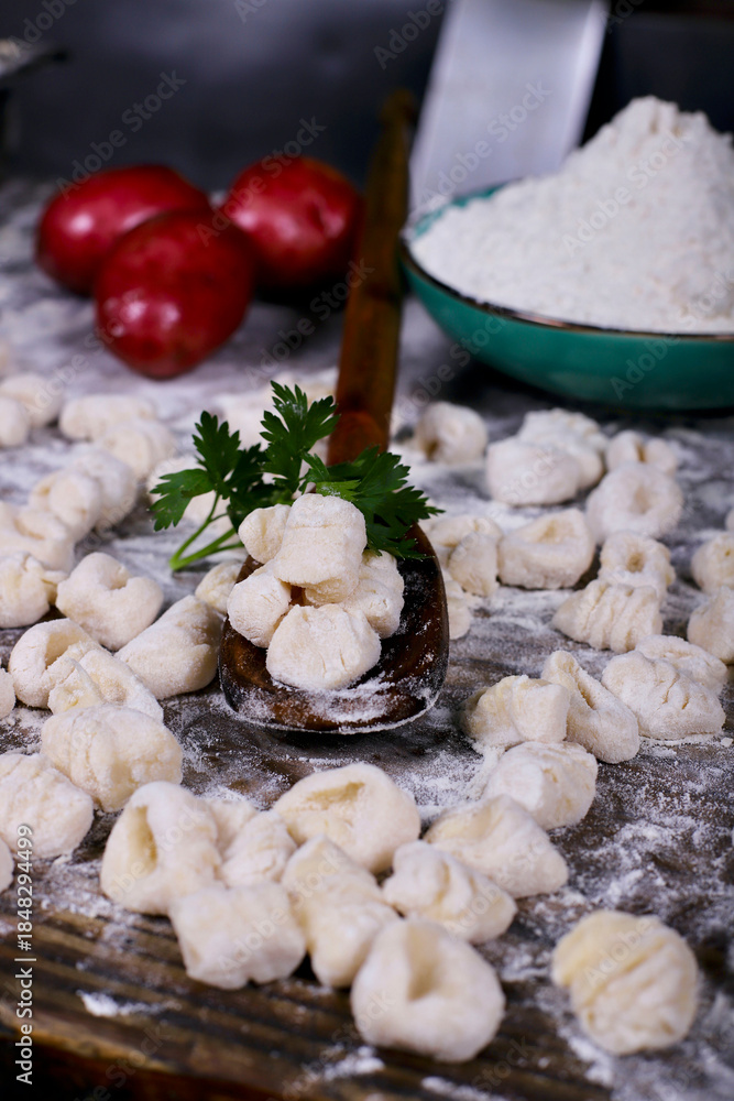 Fototapeta premium chef preparing gnocchi by hand in the traditional way