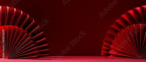 Elegant oriental red paper fans on a red surface, traditional lunar new year festive background.