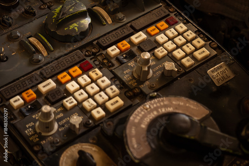 Bilde på lerret Close-up of an old, dusty, and complex control panel with many buttons and levers