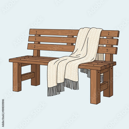 wooden park bench with white blanket draped over it for outdoor seating and relaxation
