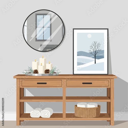 Interior space with decorative candles, framed winter landscape photograph, and mirror on wooden