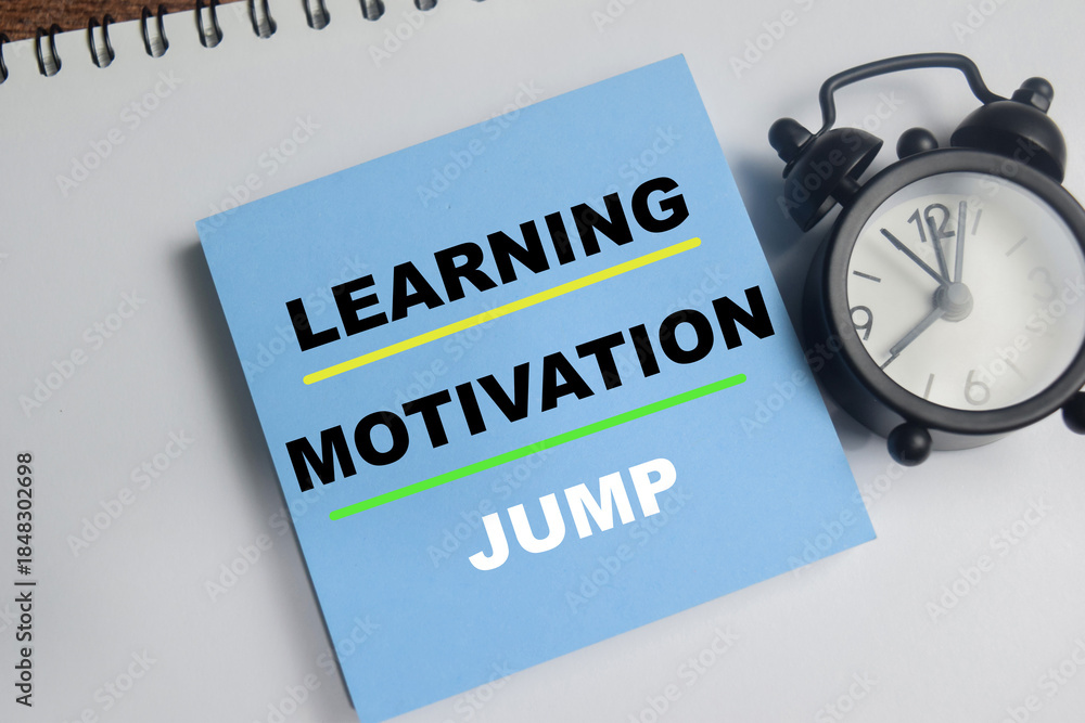 Fototapeta premium Concept of learning, motivation, jump write on sticky notes isolated on Wooden Table.