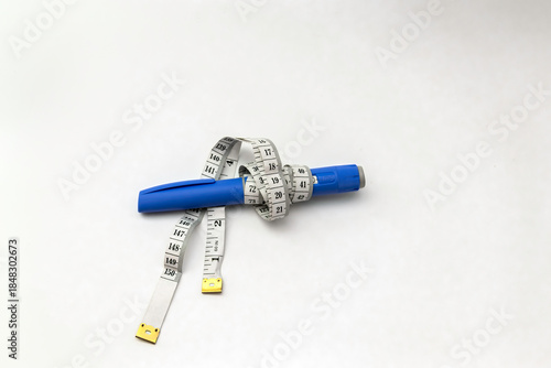 Foto Semaglutide  Injection Pen like Ozempic with Measuring Tape on White Background,