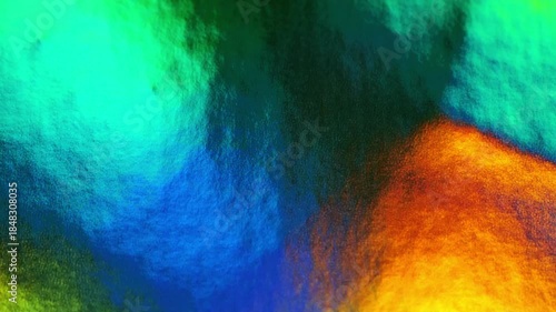 multicolored background.shiny surface with highlights of color in blue, green, orange tones.lacquer texture with light reflections.Christmas and New Year wallpaper.holiday card background. 4k footage