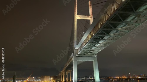 Yokohama Bay Bridge and illuminated Yokohama Port skyline at night seen from a ferry

