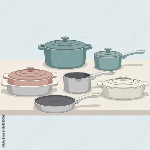Set of colorful and diverse cookware including pots pans and lids for cooking and kitchen use