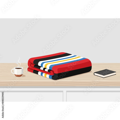Neatly Folded Colorful Towels on a Wooden Surface with a Coffee Cup and Notebook in a Cozy Home