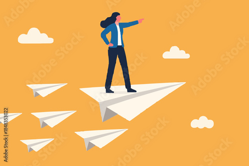 Business leadership, woman power to lead company to achieve target, smart confidence businesswoman standing on leading flying paper airplane origami pointing finger to the direction to reach goal.
