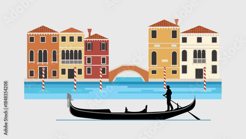 Gondola boat with gondolier on a canal in Venice.