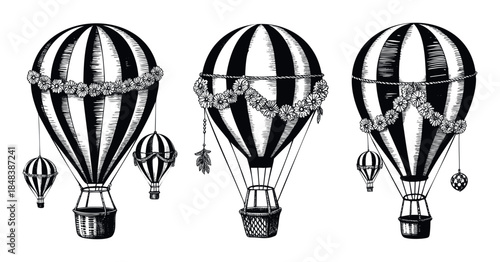 Hand drawn collection of vintage hot air balloons decorated with flower garlands for romantic travel posters or celebratory invitations