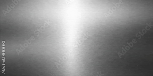 A polished stainless steel plate features a brushed silver metallic texture with a shiny industrial chrome surface and light grey reflection on a seamless aluminum backdrop pattern
