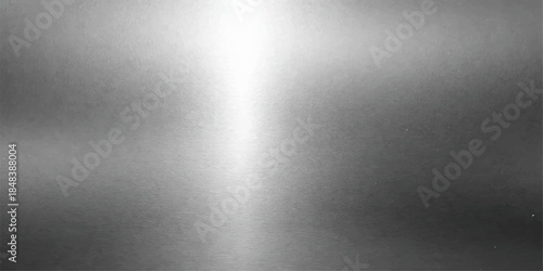 Polished silver brushed metal texture background with a shiny metallic stainless steel plate surface featuring a gray industrial aluminum material pattern and light reflection backdrop